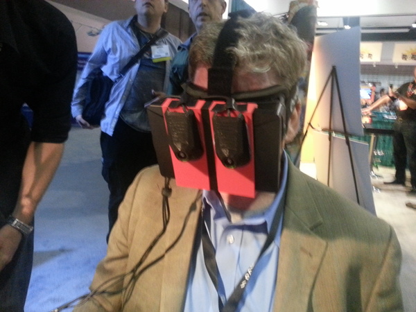 Man with two cameras taped to an Oculus Rift.